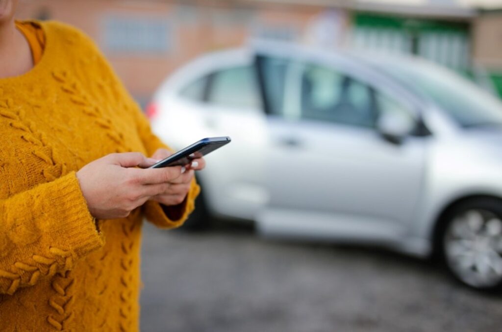 A woman googling a question after a car accident